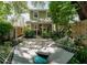 Charming backyard with a hammock, lush landscaping, and a cozy patio area at 945 Hamilton Ct, Palm Harbor, FL 34683