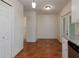 Open dining area showcasing terra-cotta tile flooring and neutral paint at 945 Hamilton Ct, Palm Harbor, FL 34683