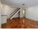 Spacious living room featuring terracotta tile, stairs to the next level, and ample space at 945 Hamilton Ct, Palm Harbor, FL 34683