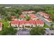 Aerial view showcases community amenities, parking and building exteriors at 9481 Highland Oak Dr # 212, Tampa, FL 33647