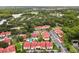 Aerial view of condo community and lush landscaping with a community pool at 9481 Highland Oak Dr # 212, Tampa, FL 33647
