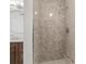 Shower stall with upgraded tile, enhancing style and functionality at 9481 Highland Oak Dr # 212, Tampa, FL 33647