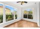 Bright bedroom with hardwood floors and large windows providing natural light at 9481 Highland Oak Dr # 212, Tampa, FL 33647