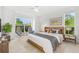 Bright bedroom with large windows, neutral tones, and stylish decor creating a serene atmosphere at 9481 Highland Oak Dr # 212, Tampa, FL 33647