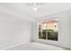 Neutral bedroom with tile flooring and natural light at 9481 Highland Oak Dr # 212, Tampa, FL 33647