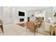 Staged living room featuring fireplace, tile floors, and sliding glass doors at 9481 Highland Oak Dr # 212, Tampa, FL 33647