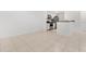 Bright living space with tiled floors and stainless steel appliances in the adjacent kitchen at 9481 Highland Oak Dr # 212, Tampa, FL 33647