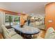 Dining area with access to kitchen and pool, featuring a unique tile table at 10053 W Bay St, Seminole, FL 33776