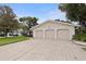 Charming home featuring a three-car garage and a well-maintained lawn at 10053 W Bay St, Seminole, FL 33776