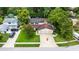 Charming home featuring a three-car garage, solar panels and a well-manicured lawn at 10053 W Bay St, Seminole, FL 33776