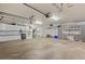 Spacious garage with white cabinets, storage solutions, and ample workspace at 10053 W Bay St, Seminole, FL 33776