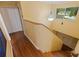 Bright hallway with wood floors, decorative lighting and view to the front door at 10053 W Bay St, Seminole, FL 33776
