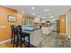 Bright eat-in kitchen boasts modern appliances, an island, and bar seating for casual dining at 10053 W Bay St, Seminole, FL 33776