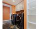 Convenient laundry room equipped with washer, dryer, and plenty of storage shelving at 10053 W Bay St, Seminole, FL 33776