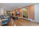 Cozy living room with hardwood floors, a comfortable sofa, and natural light at 10053 W Bay St, Seminole, FL 33776