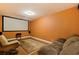 Cozy theater room setup with large screen and comfortable seating, perfect for movie nights at 10053 W Bay St, Seminole, FL 33776