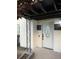 Entrance of a white front door with glass and black accents and a decorative metal security bar at 104 W Wildwood St, Tampa, FL 33613