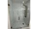 Modern shower featuring marble wall and floor tiling, and bronze hardware at 104 W Wildwood St, Tampa, FL 33613