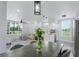 Open-concept dining and living area featuring modern decor, stainless steel appliances, and natural light at 10520 White Lake Ct # 10520, Tampa, FL 33626