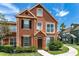 Exterior elevation of the two-story home with lush landscaping at 10520 White Lake Ct # 10520, Tampa, FL 33626