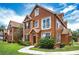 Inviting two-story home with well-manicured lawn and charming architectural details on a beautiful sunny day at 10520 White Lake Ct # 10520, Tampa, FL 33626