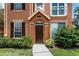 Close up of the front door of the home featuring green landscaping at 10520 White Lake Ct # 10520, Tampa, FL 33626