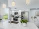 Contemporary kitchen featuring stainless steel appliances, marble countertops, and a stylish faucet and fixtures at 10520 White Lake Ct # 10520, Tampa, FL 33626
