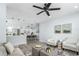 Bright living room featuring modern furnishings, stylish decor, and an open concept design to the dining area at 10520 White Lake Ct # 10520, Tampa, FL 33626
