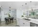 Stylish kitchen with stainless appliances overlooking dining area and sun-drenched living room at 10520 White Lake Ct # 10520, Tampa, FL 33626