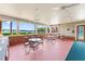Outdoor patio area with ceiling fans and lake view seating, ideal for relaxing or entertaining guests at 10520 White Lake Ct # 10520, Tampa, FL 33626