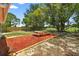 Enjoy the privacy of a wooden fenced in yard with a picnic table on mulch at 11520 Meadow Dr, Port Richey, FL 34668