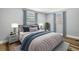 Staged bedroom with neutral walls, two windows with new blinds and curtains, and modern decor at 11520 Meadow Dr, Port Richey, FL 34668