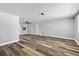 Bright living room featuring modern flooring, neutral walls, and ample natural light at 11520 Meadow Dr, Port Richey, FL 34668