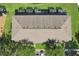 A high angle view displays the roof structure of attached townhomes with green space at 12228 Foxmoor Peak Dr, Riverview, FL 33579
