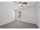 Bright bedroom with carpet, a ceiling fan, and a window providing natural light at 12228 Foxmoor Peak Dr, Riverview, FL 33579