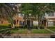 Charming townhome featuring well-manicured lawn, and lush greenery, creating a welcoming curb appeal at 12228 Foxmoor Peak Dr, Riverview, FL 33579