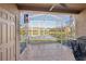 Enjoy the outdoors on this screened lanai with tile flooring and a beautiful lake view at 12228 Foxmoor Peak Dr, Riverview, FL 33579