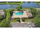 A refreshing community pool is surrounded by manicured landscaping and offers a serene spot for relaxation at 12228 Foxmoor Peak Dr, Riverview, FL 33579
