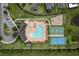 An aerial view of community amenities that include a pool, playground, basketball, and tennis court at 12451 Nouveau Ave, Spring Hill, FL 34610