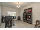 Entertainment area with a custom bar, stools, and display cabinets for beverages at 12451 Nouveau Ave, Spring Hill, FL 34610