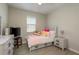 Comfortable bedroom with natural light, dresser, and plush decor at 12451 Nouveau Ave, Spring Hill, FL 34610