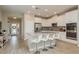 Spacious kitchen featuring a center island, white cabinetry, and modern stainless-steel appliances at 12451 Nouveau Ave, Spring Hill, FL 34610