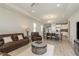 Inviting living room with open layout to the kitchen and dining area, perfect for entertaining at 12451 Nouveau Ave, Spring Hill, FL 34610