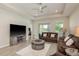 Relaxing living room with access to the patio, offering great natural light and a comfortable setting at 12451 Nouveau Ave, Spring Hill, FL 34610