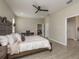 Comfortable main bedroom offering a tranquil retreat with an open flow to the bathroom at 12451 Nouveau Ave, Spring Hill, FL 34610