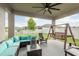 Inviting covered patio with comfortable seating and backyard view at 12451 Nouveau Ave, Spring Hill, FL 34610
