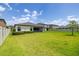 Expansive backyard with lush green grass and a white fence, ideal for outdoor activities and entertainment at 12652 Shetland Walk Dr, Lithia, FL 33547