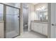 Bathroom featuring modern vanity, granite countertop, updated fixtures, and glass enclosed shower at 12652 Shetland Walk Dr, Lithia, FL 33547