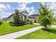 Attractive house with neatly trimmed shrubs, green lawn, and a spacious driveway at 12652 Shetland Walk Dr, Lithia, FL 33547