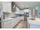 Beautiful bright kitchen with white cabinets, subway tile backsplash, and stainless steel appliances at 12652 Shetland Walk Dr, Lithia, FL 33547